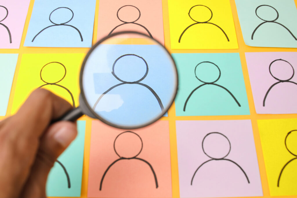 Magnifying glass over images of people